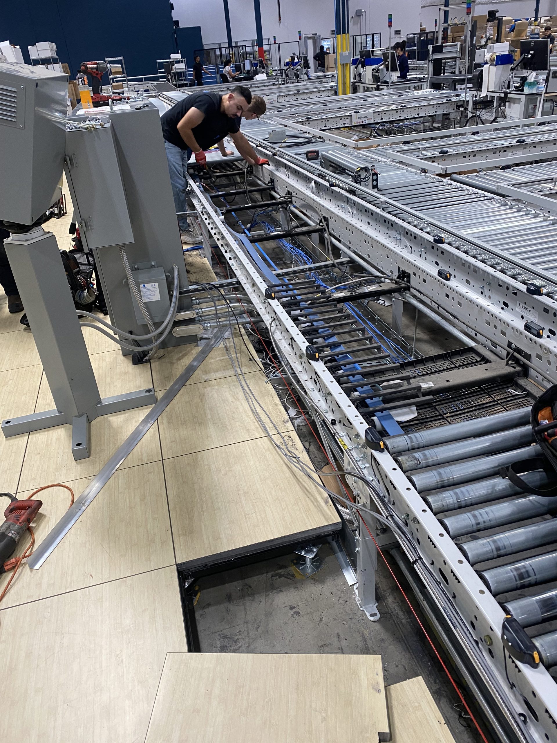 Technicians installing new conveyor line